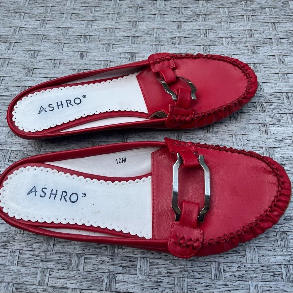 Ashro red flat slip on mules, silver decor front buckle, 1 inch heel, size 10 M.
